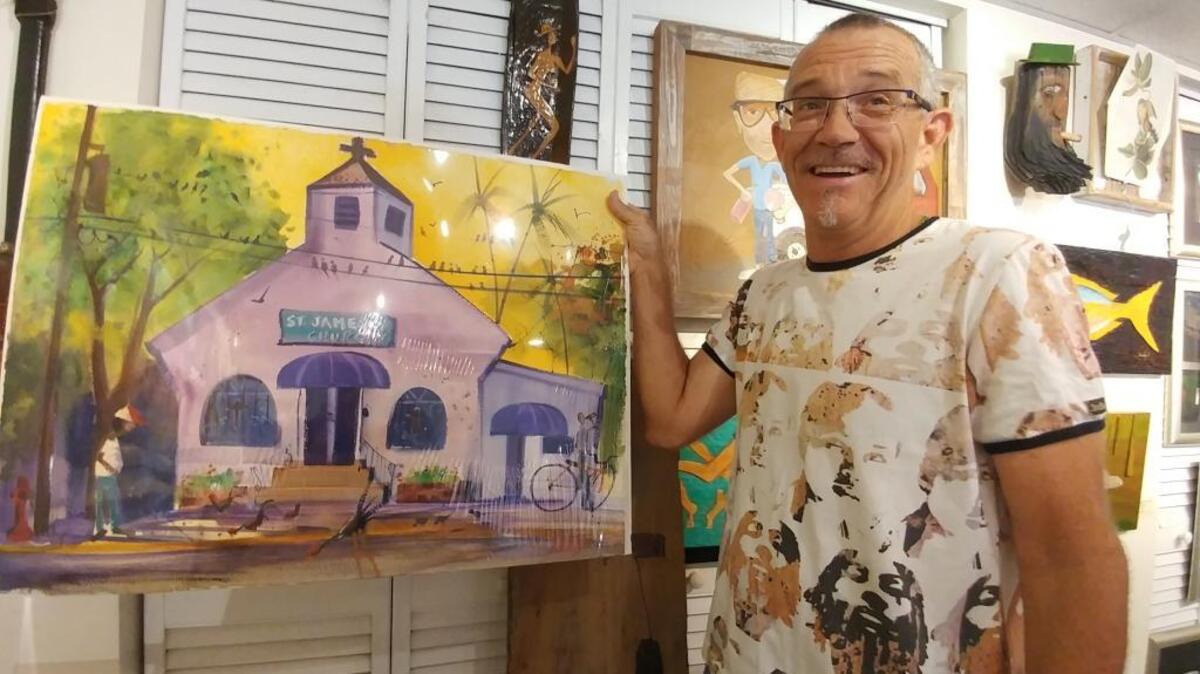 Andy Thurber shows a new painting of a local church as he prepares for an Oct. 22 opening in Key West.