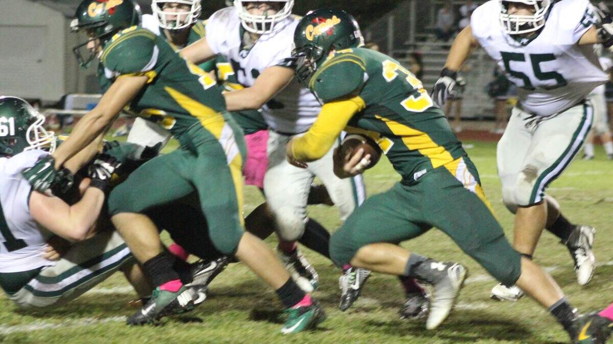 Eddie Dunn rushes for some of the 903 yards gained during his senior year at Coral Shores High School in 2014. Dunn continues the family tradition of making the football team roster at University of Miami.