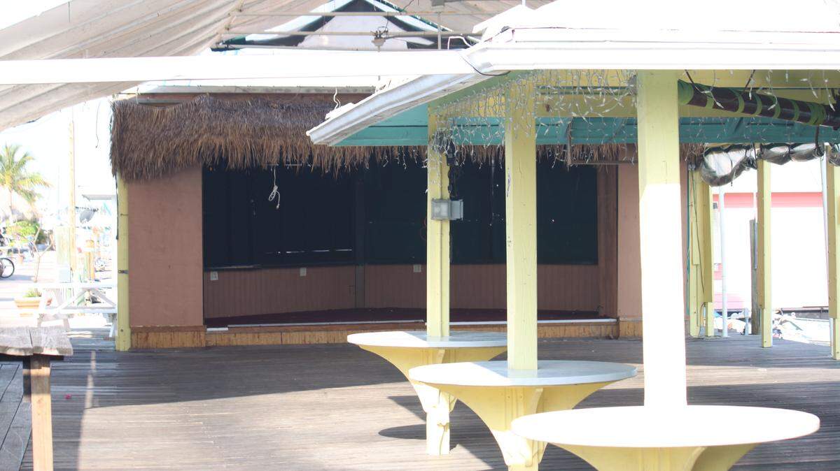 Dockside Tropical CafÃ© at 35 Sombrero Blvd. in Marathon sits empty Friday as owners Eric Stone and Kim Hess-Stone closed down the restaurant Monday. According to www.docksidetropicalcafe.com, the two had disputes with property owner Brian Sweeny on the purchase price, which ultimately caused them to shut down.