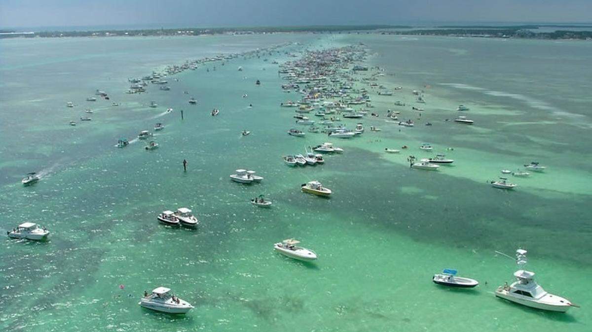 The Sandbar off Islamorada fills with scores of boat during Memorial Day weekend in 2016. Law enforcement in South Florida is expecting similar scenes this holiday weekend.
