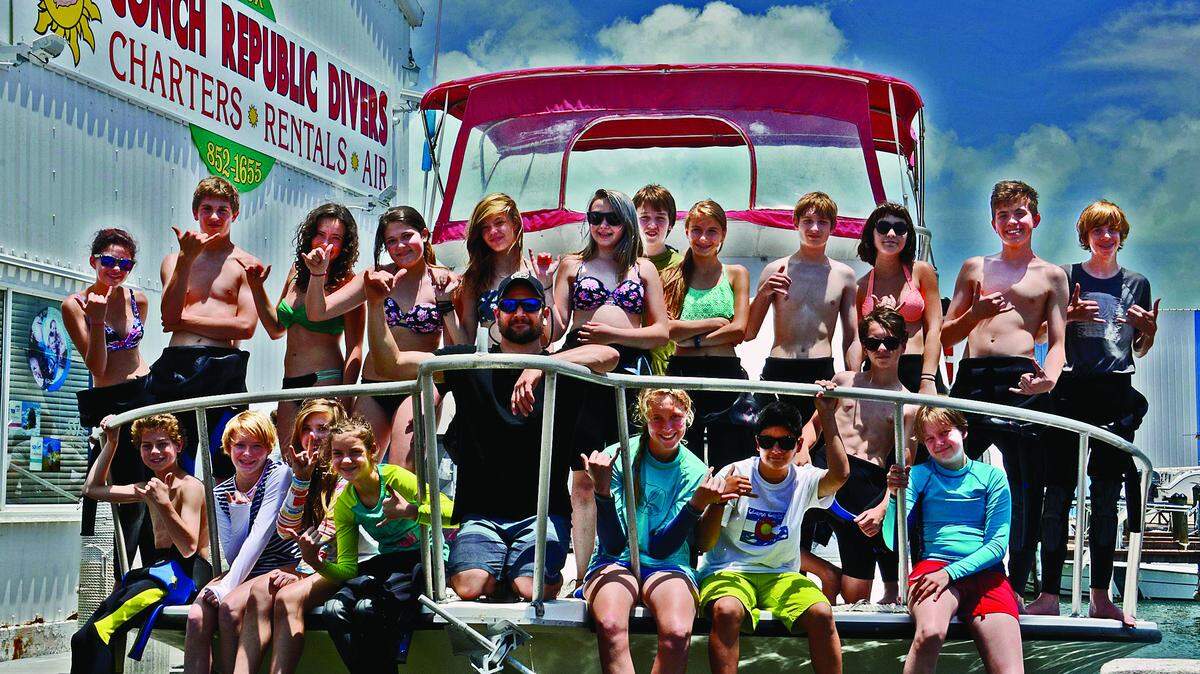 Students from Colorado gather on the deck of a Conch Republic Divers boat before heading out to plant coral samples on the reef.