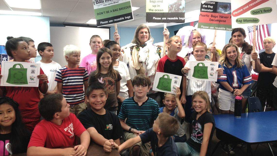 The kids seem enthusiastic about recycling efforts.