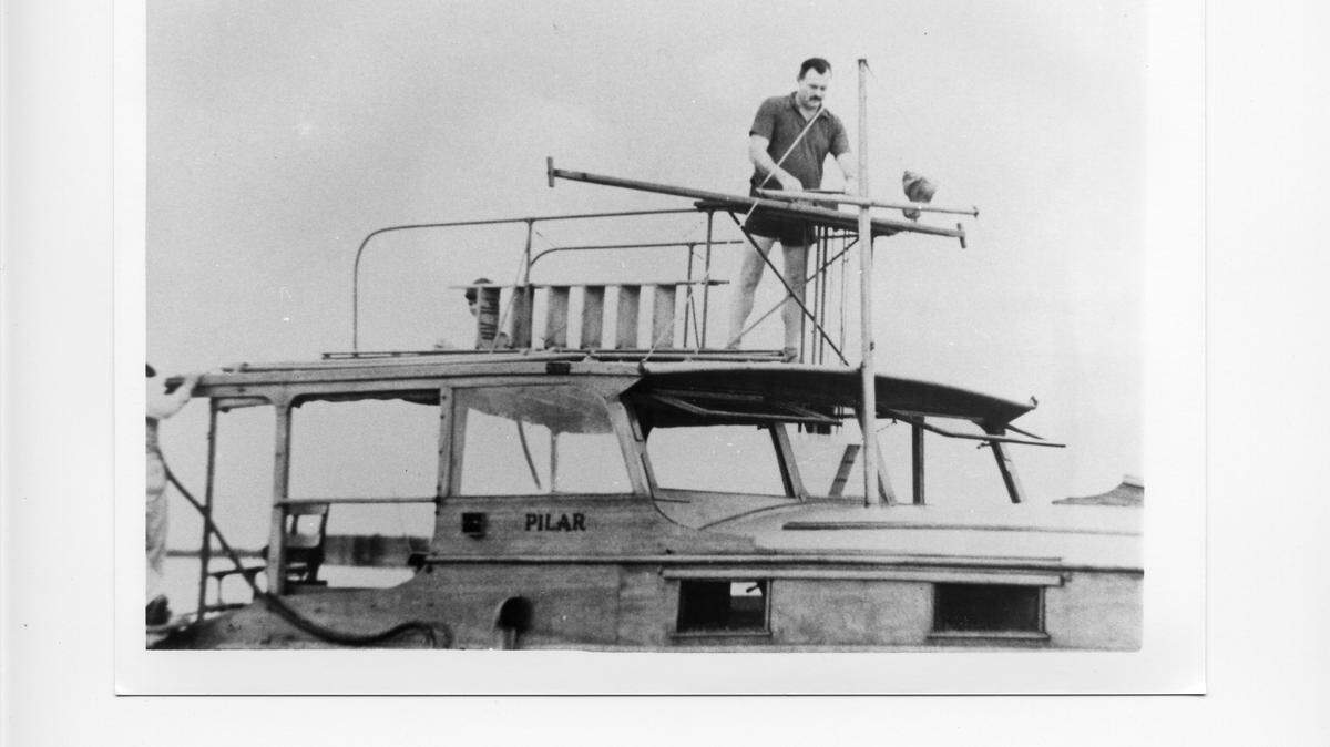 Author Ernest Hemmingway aboard his vessel Pilar. Hemmingway sued his boat to shuttle supplies in to survivors of the 1935 hurricane that devastated Islamorada. (Photo courtesy of Jerry Wilkinson/Historical Preservation Society of the Upper Keys)