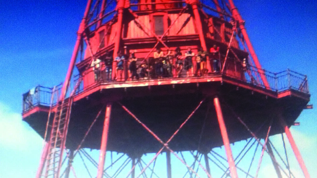 Cuban migrants stand on a platform of the American Shoal Light during a May 20 standoff with the U.S. Coast Guard.