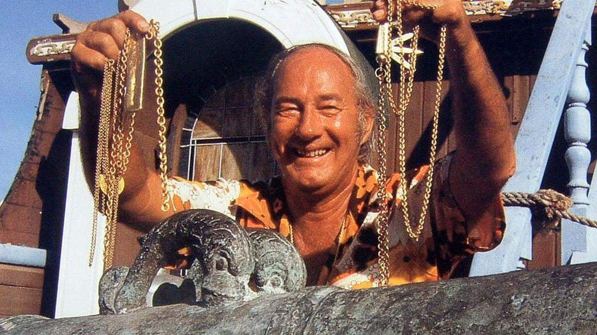 Mel Fisher shows off some of the bounty from the Atocha.