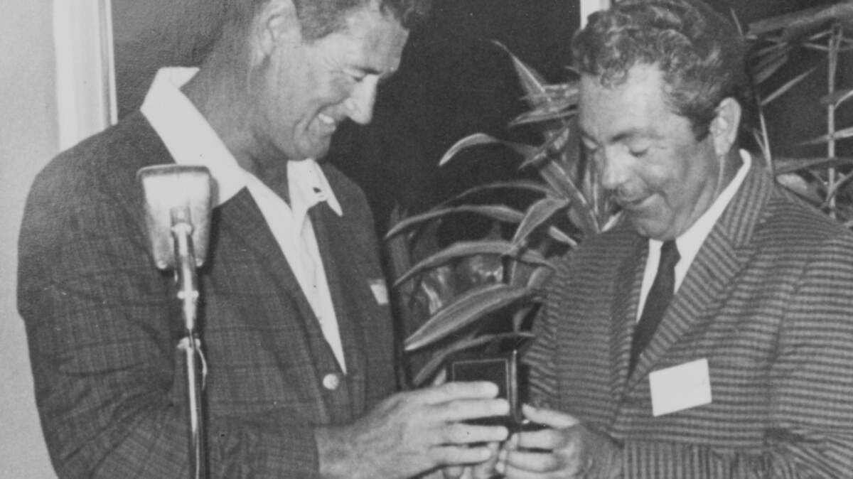 Ted Williams presents an unidentified man an award during a
ceremony in Islamorada. (Photo courtesy of Jerry
Wilkinson/Upper Keys Historical Preservation Society)
