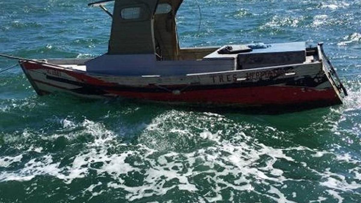 A single-engine fishing boat floats off Big Pine Key. The vessel brought three men from Cuba to the Florida Keys on Sunday, Oct. 23, 2015. U.S. Border Patrol