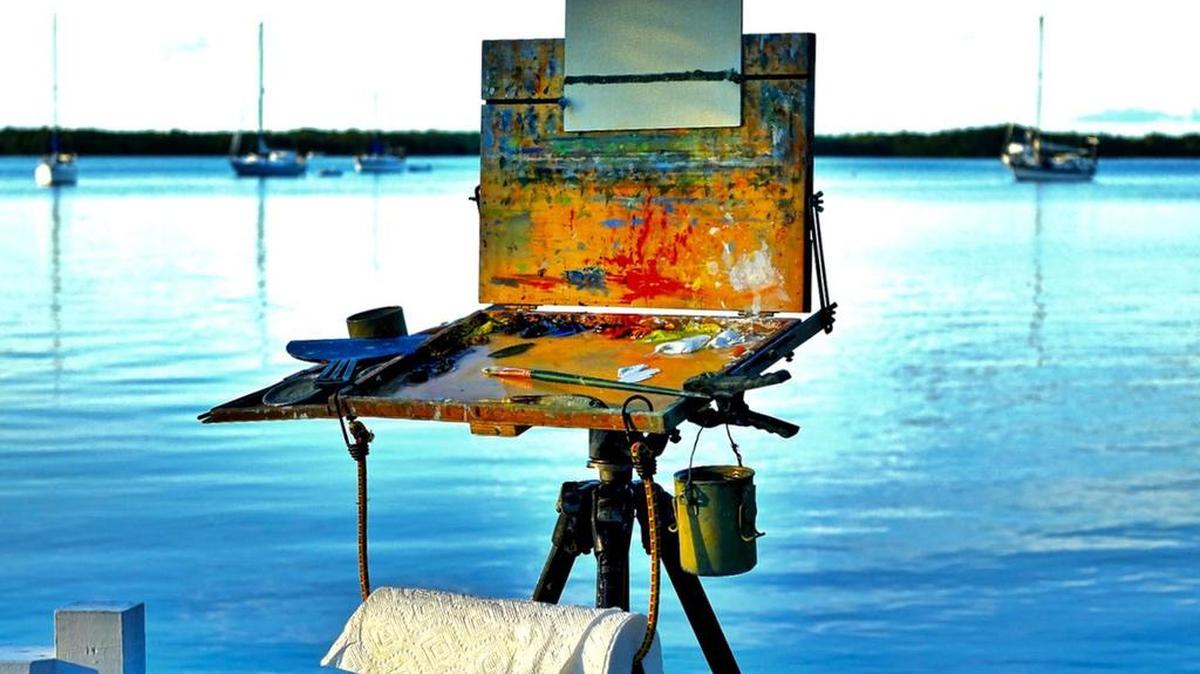 An easel is set up at Largo Resort at mile marker 101.7 for a sunset painting during the 2015 Paradise Paint Out plein air event.
