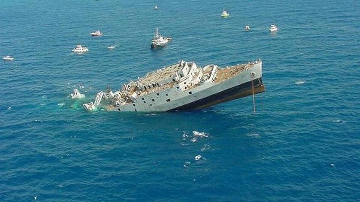 The ‘Spiegel Grove’ should have gone straight down when it was intentionally sunk as to be used as a dive site off Key Largo on May 17, 2002.. Instead, it sank prematurely and those aboard had to be helicoptered and boated off the vessel.