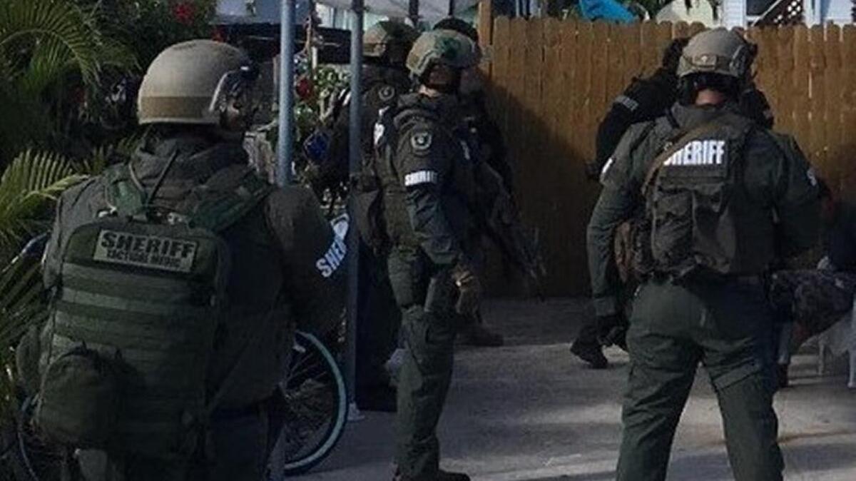 The Monroe County Sheriff’s Office SWAT Team and detectives securing the scene on Avenue F on Big Pine Key Saturday during the arrest of Duviel Gonzalez. Gonzalez has a Marathon address but he was on Big Pine when he was taken into custody.