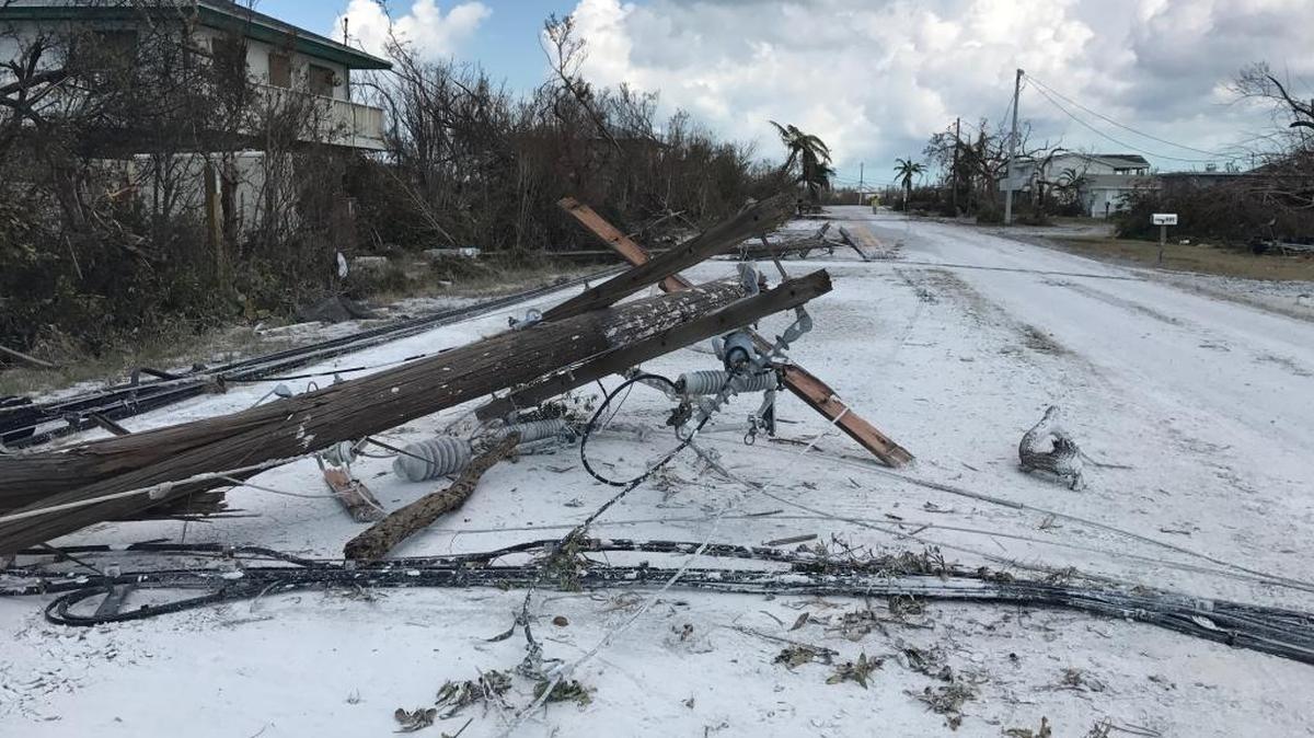 Marl-like mud from the Gulf of Mexico makes a neighborhood road on Little Torch Key look like it’s covered in snow, as downed poles and power lines lie toppled on the ground days after Hurricane Irma hit the area hard on Sept. 10, 2017. Monroe County and other Keys municipalities are waiting on federal money for reimbursement for the tens of millions of dollars that was spent during initial recovery operations following the powerful Category 4 storm.