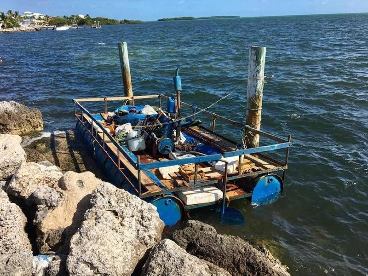 A rustic vessel made by Cuban migrants is docked behind Key Largo Ocean Resort in Key Largo. It arrived  during a spike in migration from Cuba. Now that has slowed.