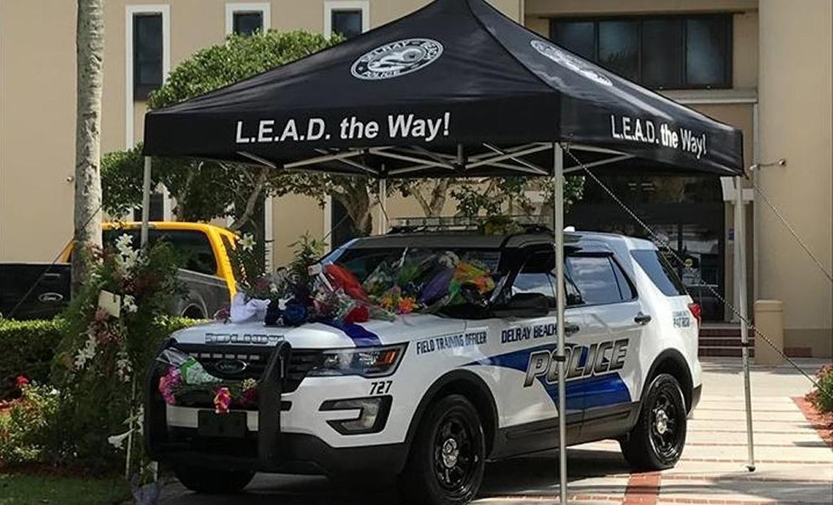 Delray Beach Police Officer Christine Braswell’s patrol car was turned into a makeshift memorial after her death.