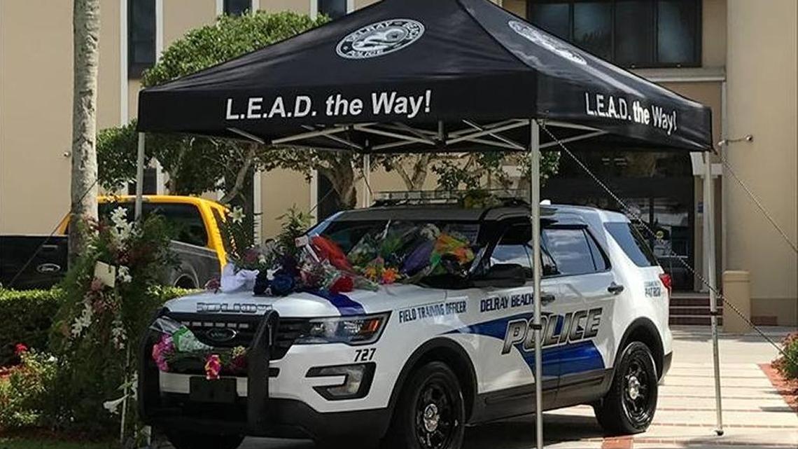 Delray Beach Police Officer Christine Braswell’s patrol car was turned into a makeshift memorial after her death.