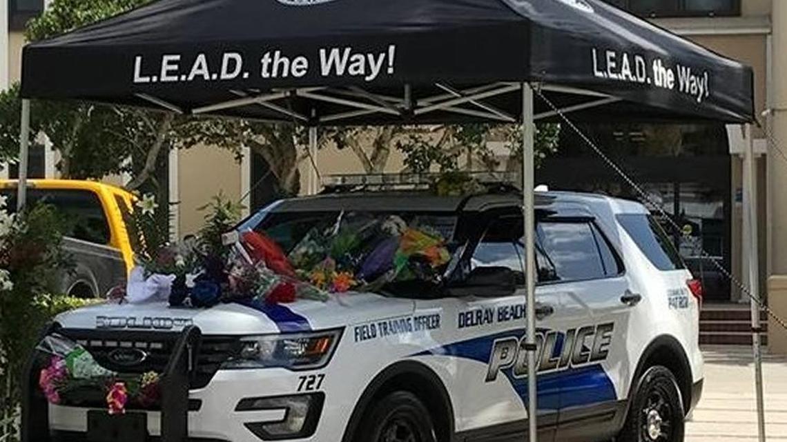 Delray Beach Police Officer Christine Braswell’s patrol car was turned into a makeshift memorial after her death.