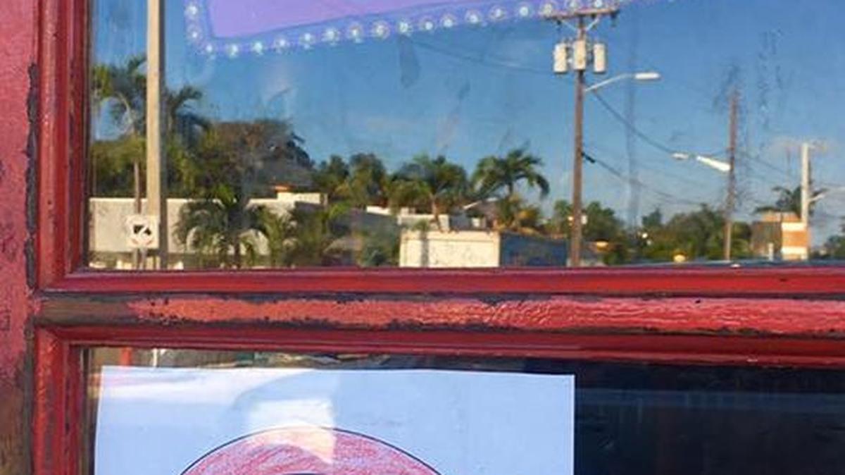 A customer made this sign for the Sunshine Grill post-robbery. The robber was armed with a garden hoe.