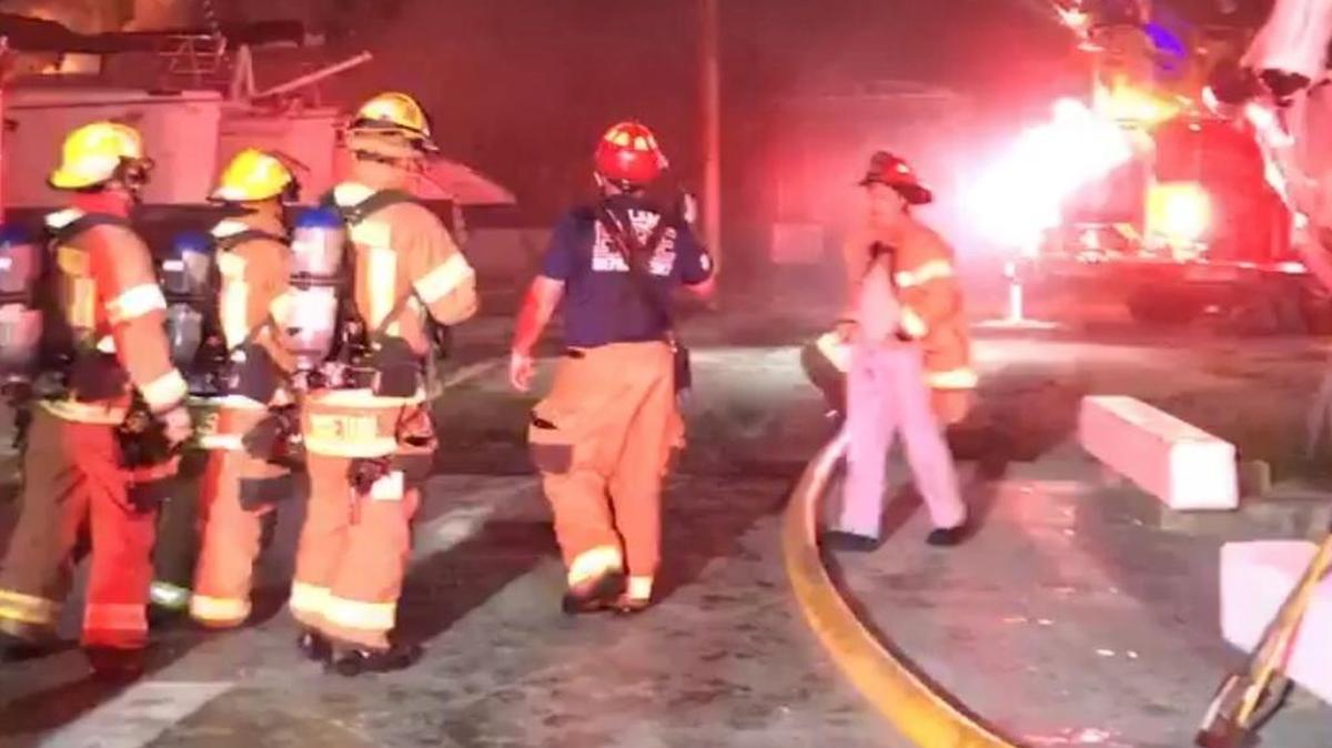 Firefighters from the Key Largo Volunteer Fire Department, Islamorada Fire rescue and Monroe Fire Rescue respond to a massive boat yard fire in Key Largo Saturday night, Jan. 20.
