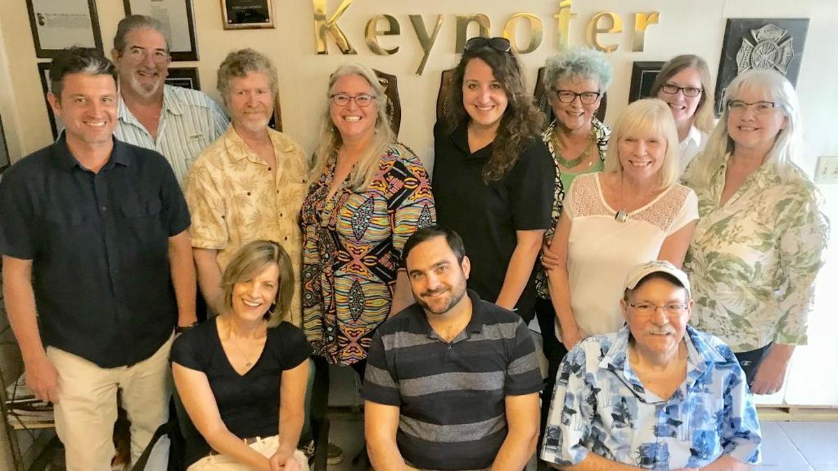 Wayne Markham, below right, publisher of the Keynoter and The Reporter, the Miami Herald’s two Florida Keys newspapers, died March 6, 2020. David Goodhue is at left.