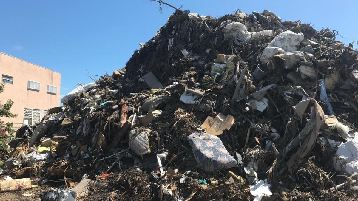Debris piles like this one in the Upper Keys are getting smaller, but not as quickly as most people want.