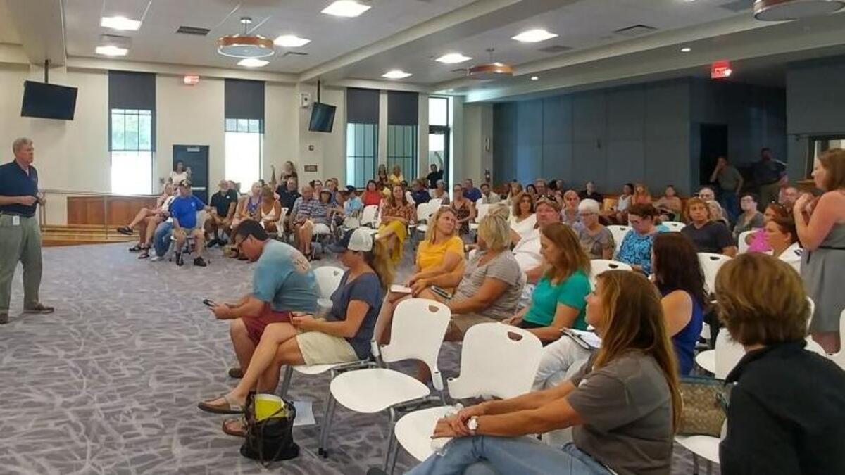 Key West residents listen to City Commissioner Sam Kaufman and City Manager Jim Scholl at Sunday’s town hall meeting at City Hall over Hurricane Irma recovery.