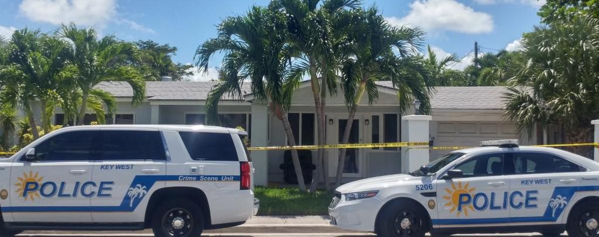 Police surround a Key West home after a brutal attack on a man Monday morning.
