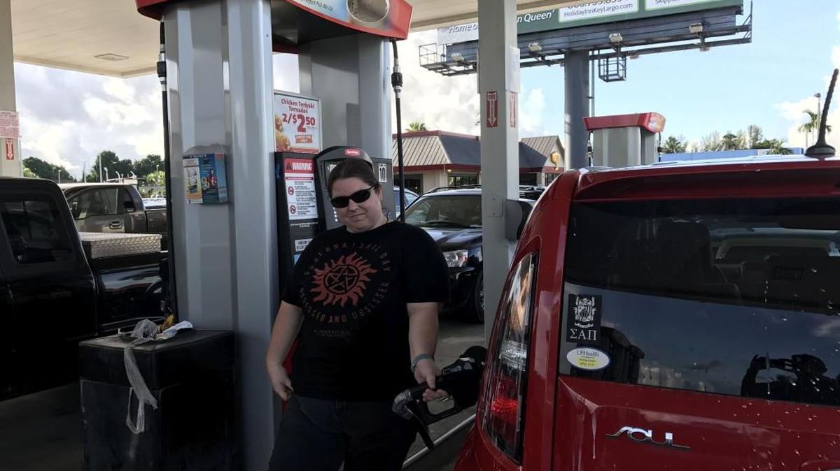 Audrey Kokenzie from Key West, fills up the tank of her Kia Soul at the Speedway gas station in Florida City.