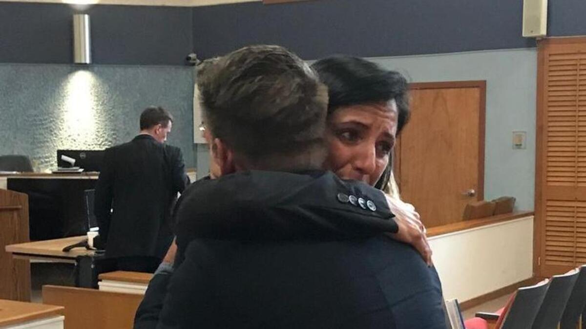Assistant State Attorney Colleen Dunne hugs Scott McBride inside the Plantation Key courthouse, Thursday, March 2, 2018. McBride was one of three tourists shot on Duval Street on March 21, 2016, by Derek David, a Louisiana man whose lawyers said he fired in self defense against men who attacked him. A jury found David guilty March 2, 2018, on three counts of attempted manslaughter with a firearm. Photo by David Goodhue/dgoodhue@keysreporter.com
