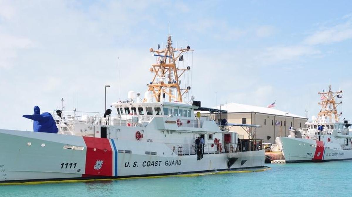 Coast Guard cutters are shown moored to the pier at Coast Guard Sector Key West.