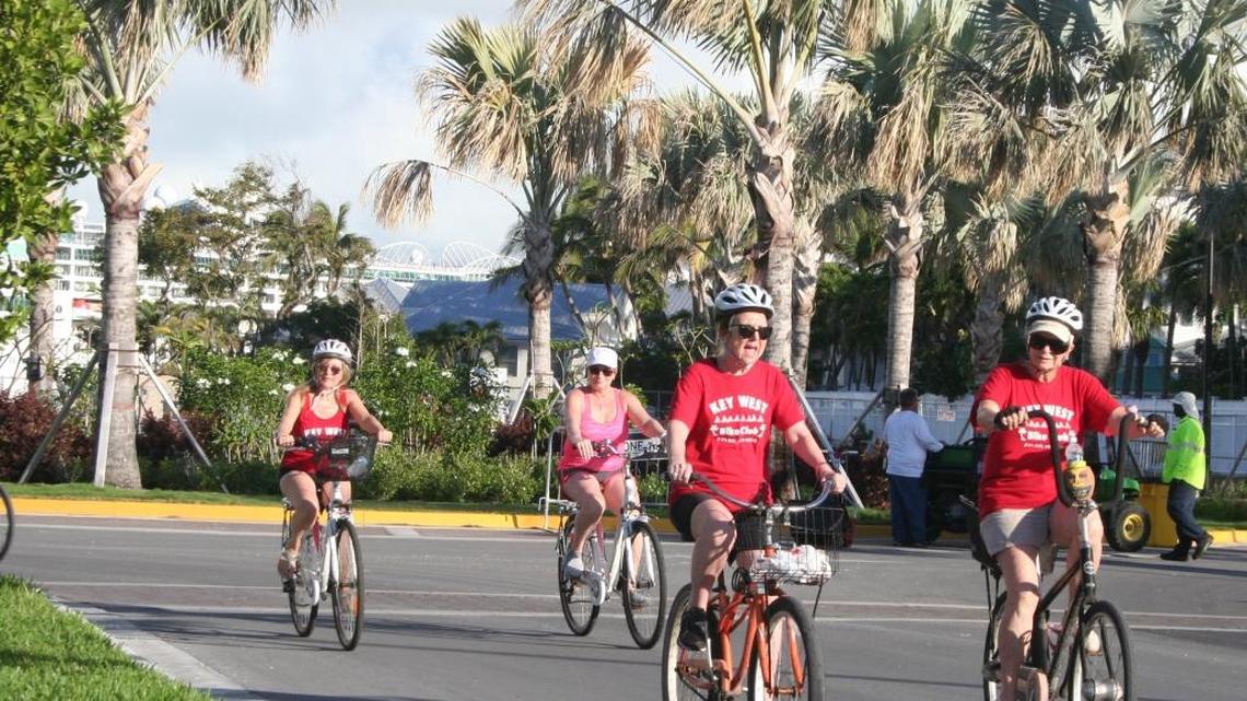 Bicyclists enjoy the fresh pavement at the park Tuesday morning.