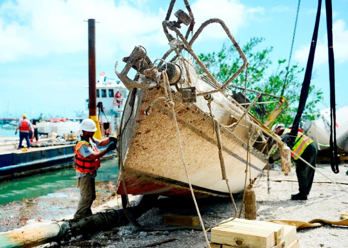 Contractors work Oct. 11, 2017, to remove a vessel displaced by Hurricane Irma at Boot Key Harbor City Marina in Marathon.