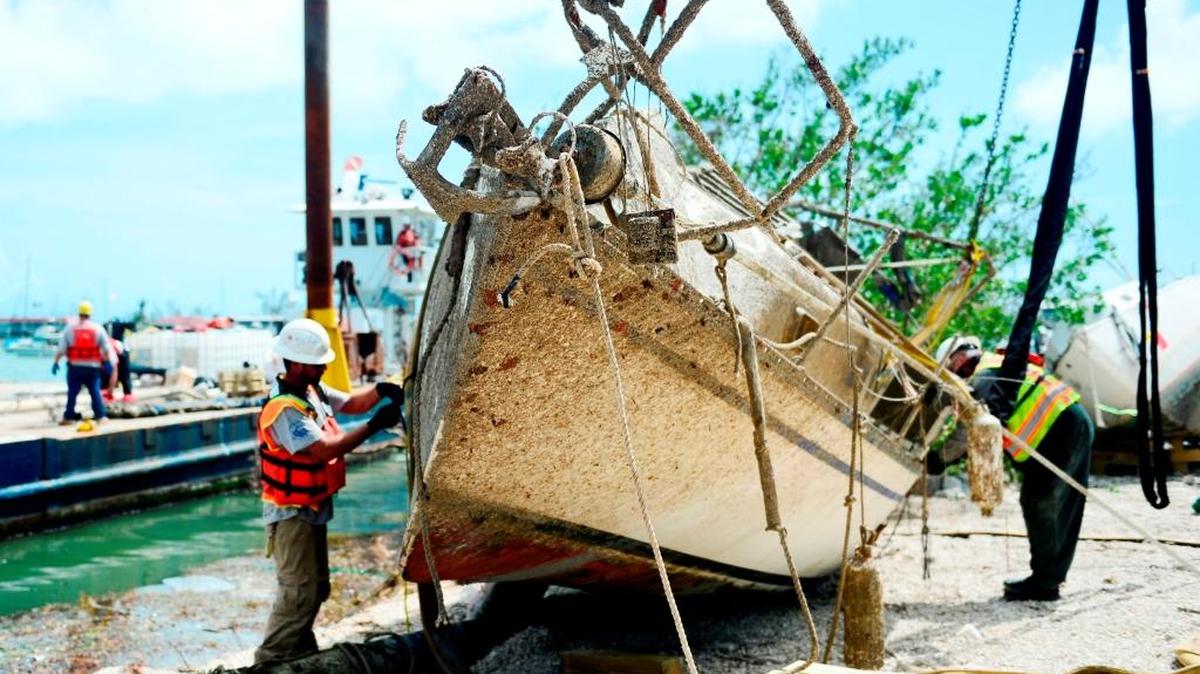 Contractors work Oct. 11, 2017, to remove a vessel displaced by Hurricane Irma at Boot Key Harbor City Marina in Marathon. 