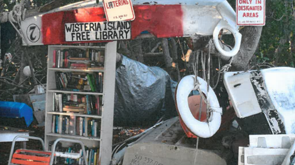 A “free library” set up among the encampments at Wisteria Island.
