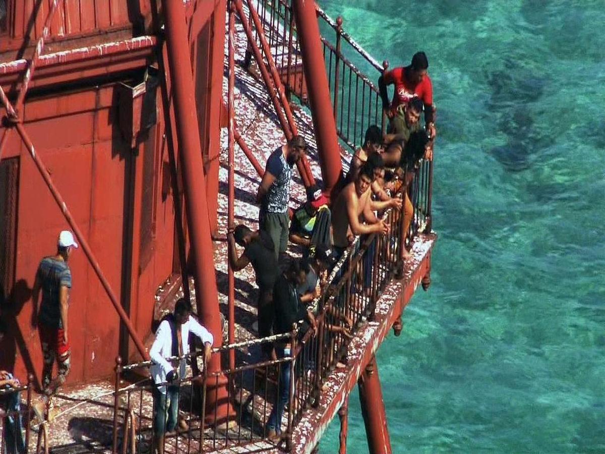 Group of Cubans atop American Shoal Lighthouse off Sugarloaf Key in standoff with Coast Guard on Friday, May 20, 2016. Photos courtesy WSVN.