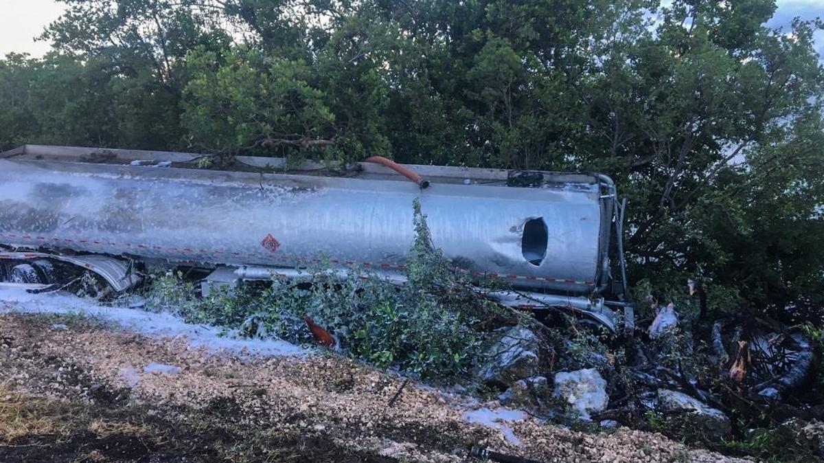 The rupture in this overturned tanker at mile marker 70 bayside, Long Key, Monday morning sent thousands of gallons of gas into the bay.