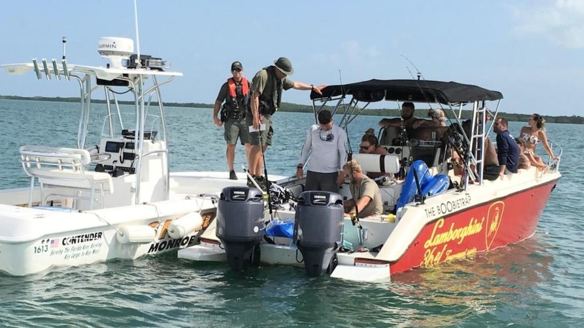 Monroe County Sheriff’s Office deputies check a boat for possible resource violations Wednesday off Marathon during the mini-season.