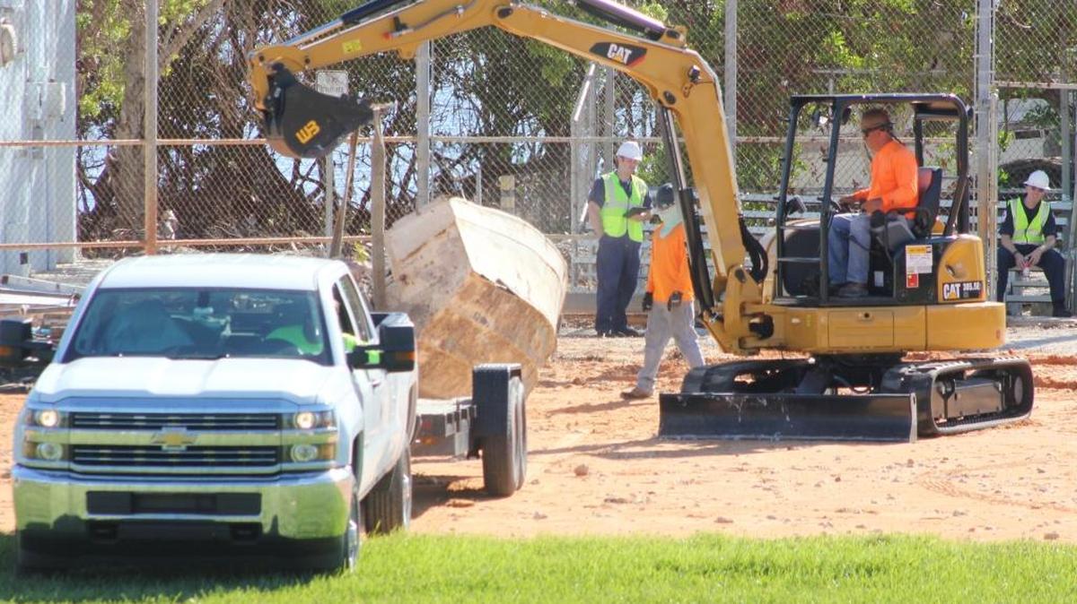 Work crews begin unloading boats sunken or moved by Hurricane Irma to the ball fields at Harry Harris Park in Tavernier last weekend. The popular park will remain closed indefinitely due to storm debris storage and needed repairs.