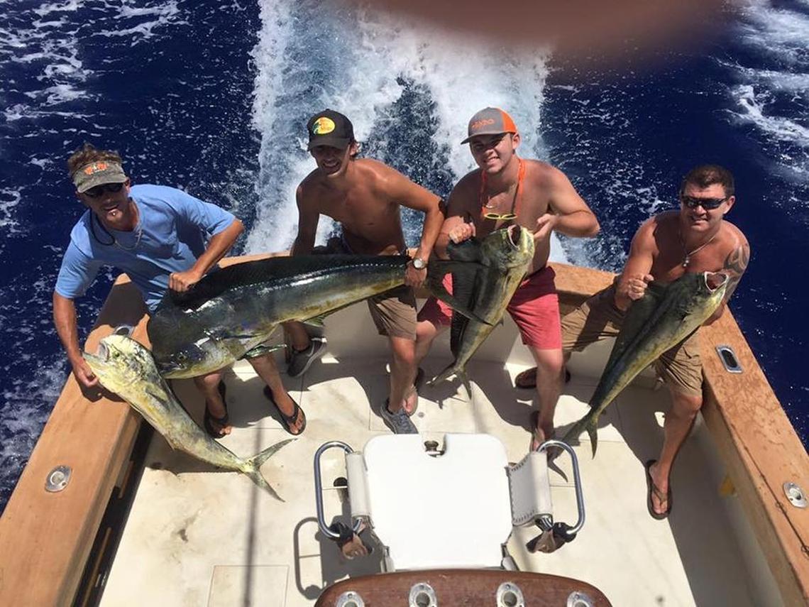 Anglers hold mahi mahi they caught on a 2016 outing with First Choice Charters out of the Post Card Inn Marina at Holiday Isle.